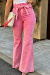 Розовые джинсы-клеш с винтажной стиркой и бантом