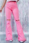 Розовые винтажные джинсы-клеш с разрезами и бахромой