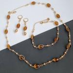 Комплект: ожерелье, серьги и браслет