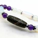 Браслет Дзи "Пятнадцать глаз" агат 10*29мм из аметиста и лунного камня шарик 8мм, 18см