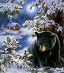 Черный медвежонок у заснеженной реки