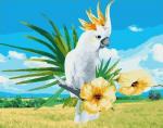 Белый попугай на цветущей ветке