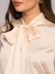 Блузка нежно-персикового цвета с бантом
