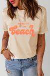 Бежевая футболка с оранжевой надписью: RATHER BE AT THE BEACH