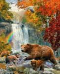 Семейство бурых медведей у водопада