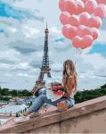Девушка с воздушными шариками на фоне Эйфелевой башне