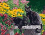 Чёрные кошки в цветочном саду